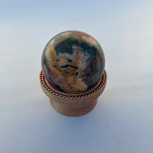 Red Creek Jasper Sphere with Tensor Ring Maple Wood Stand